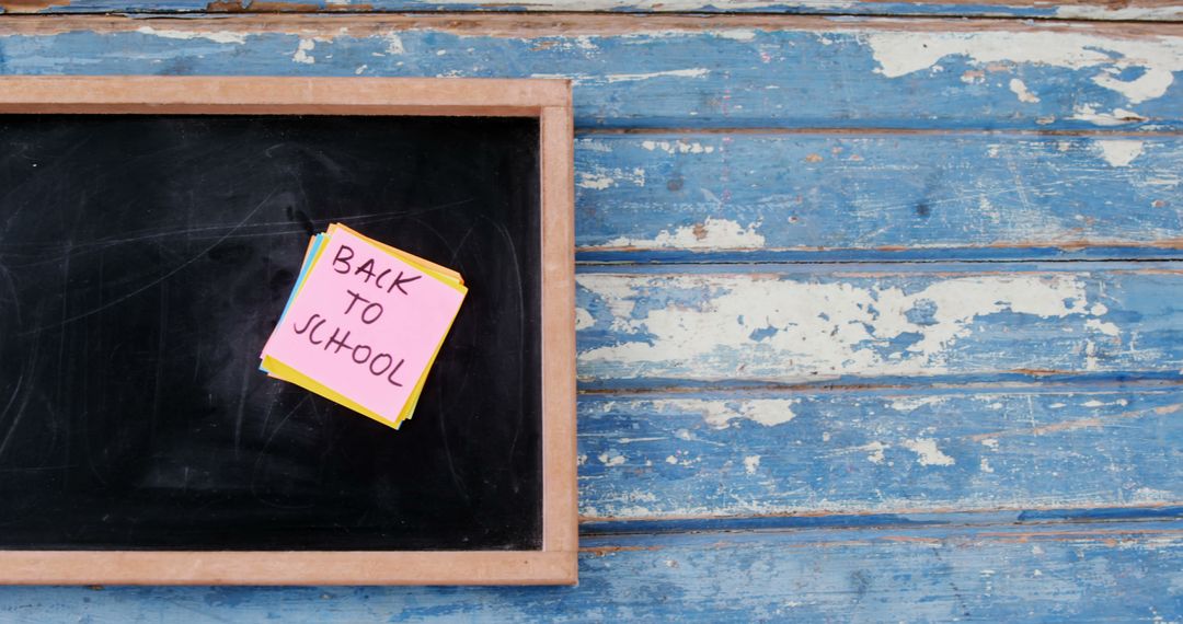 Back to School Note on Chalkboard with Rustic Blue Background