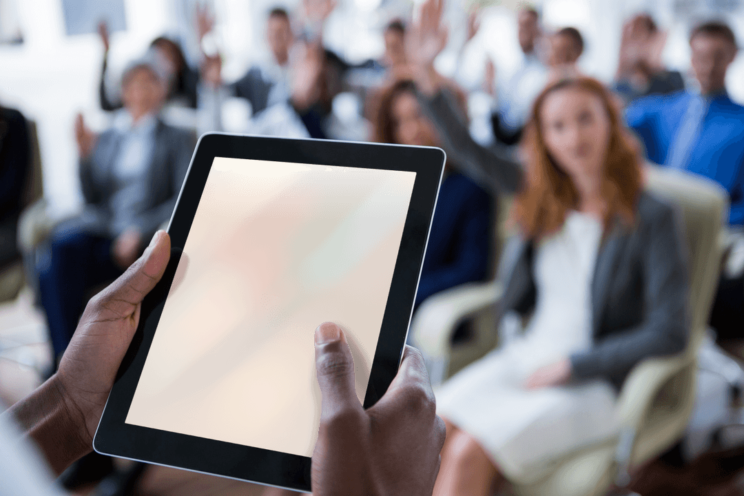 Businessperson Interacting with Transparent Tablet in Meeting