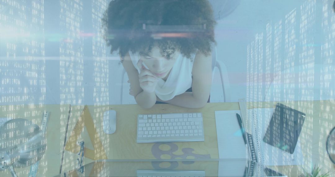 Thoughtful Woman in Modern Office Analyzing Data on Computer
