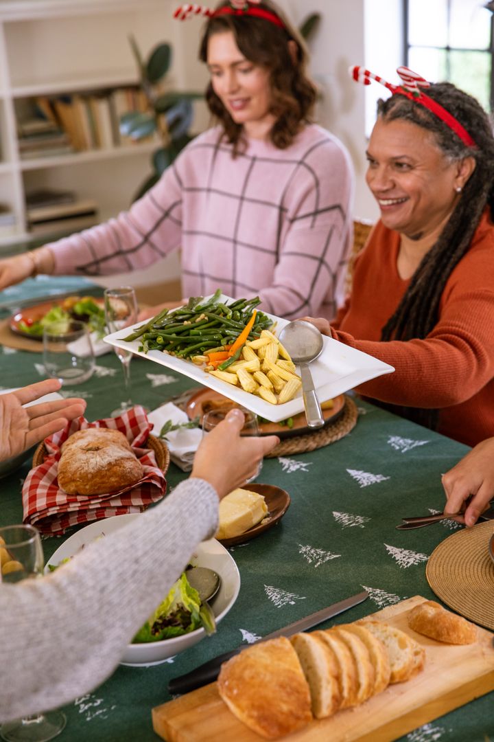 Festive Family Gathering with Sharing Warm Meal at Home