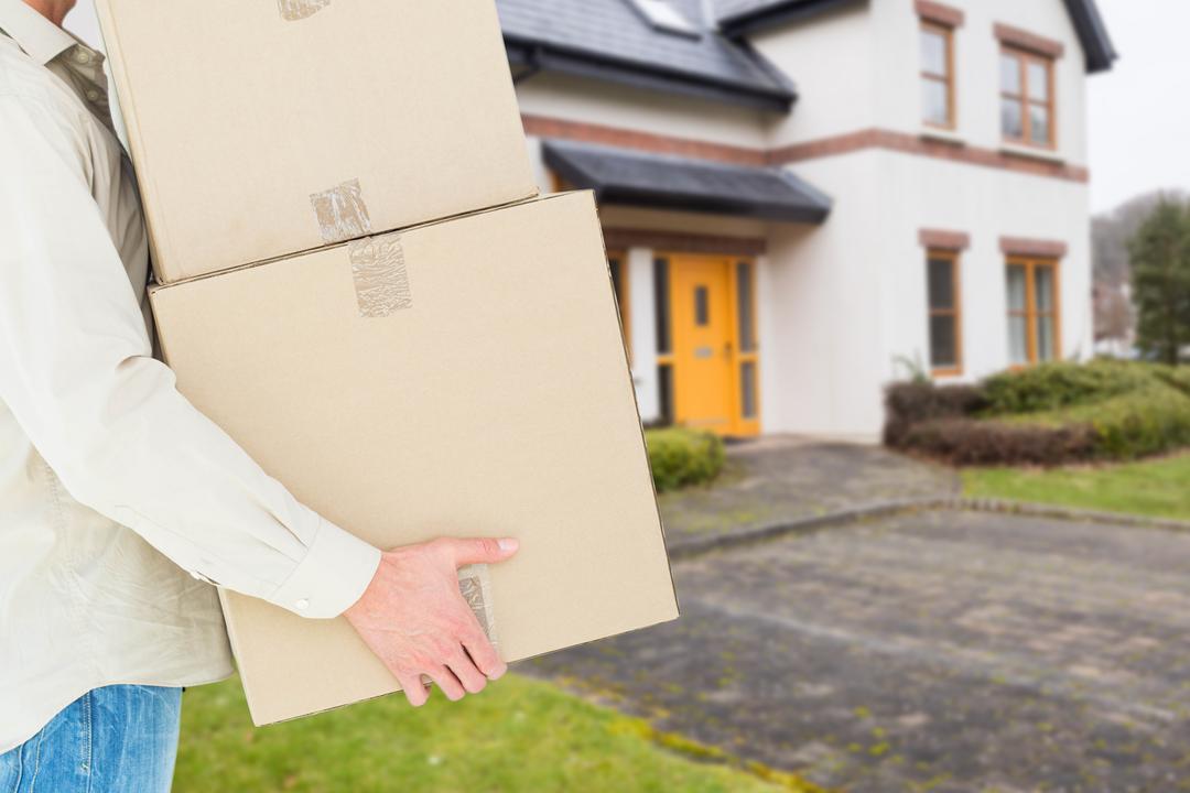 Person Carrying Moving Boxes into New Home - Free Images, Stock Photos and Pictures on Pikwizard.com