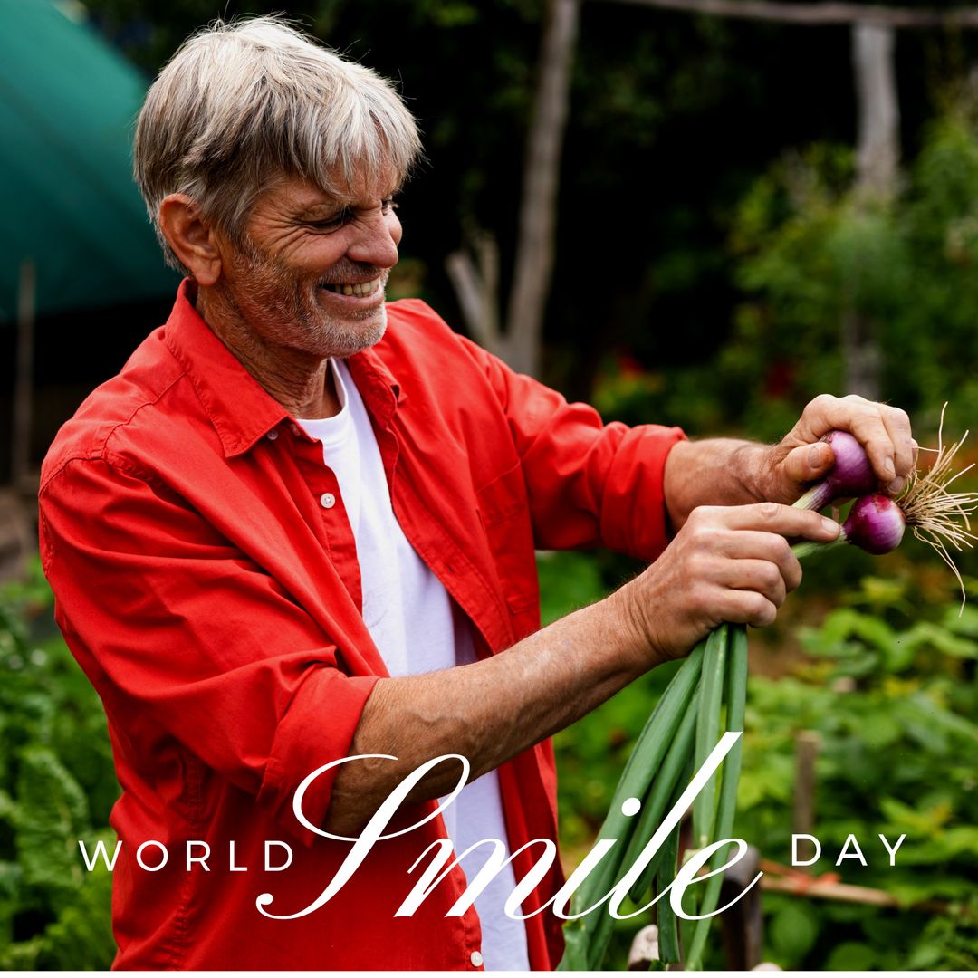 Smiling Senior Gardener Harvesting Fresh Onions in Lush Garden
