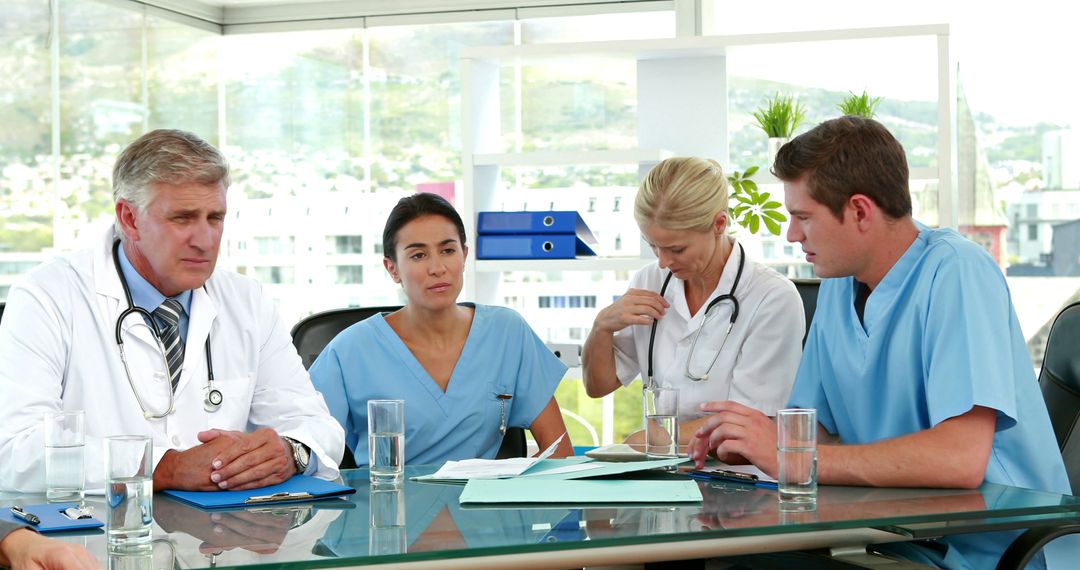 Medical Team Discussing Patient Care in Conference Room - Free Images, Stock Photos and Pictures on Pikwizard.com