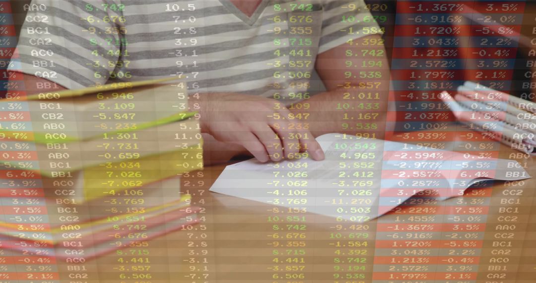 Hands Crafting Paper Airplane Overlayed with Stock Market Data
