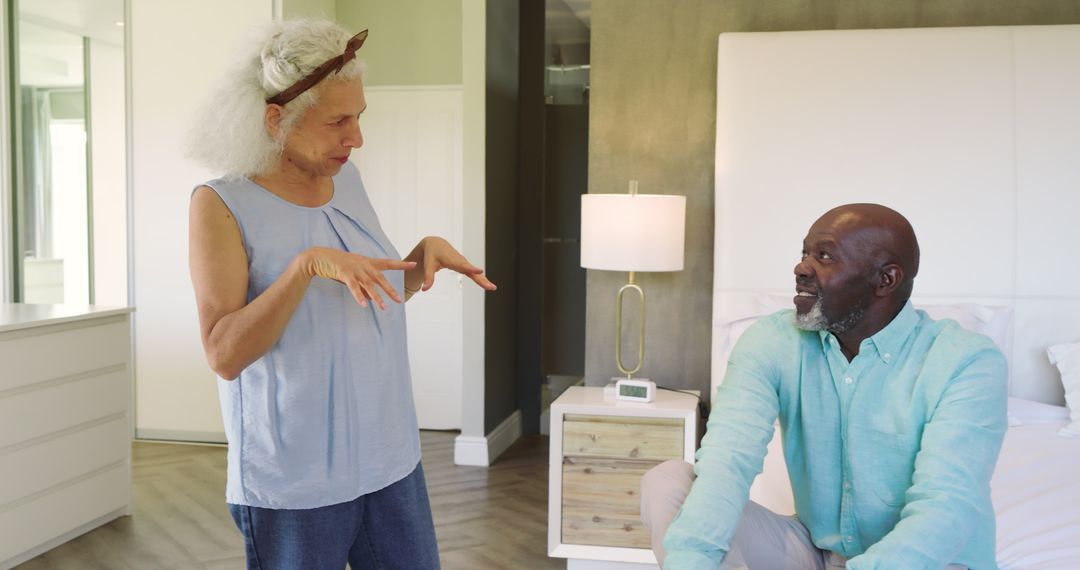 Diverse Couple Sharing Laughter and Connection in Modern Bedroom