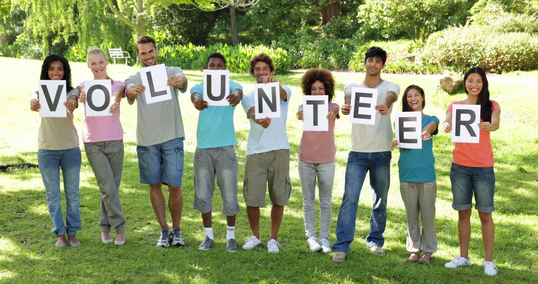 Diverse Group Enthusiastically Promoting Volunteer Spirit in Park - Free Images, Stock Photos and Pictures on Pikwizard.com