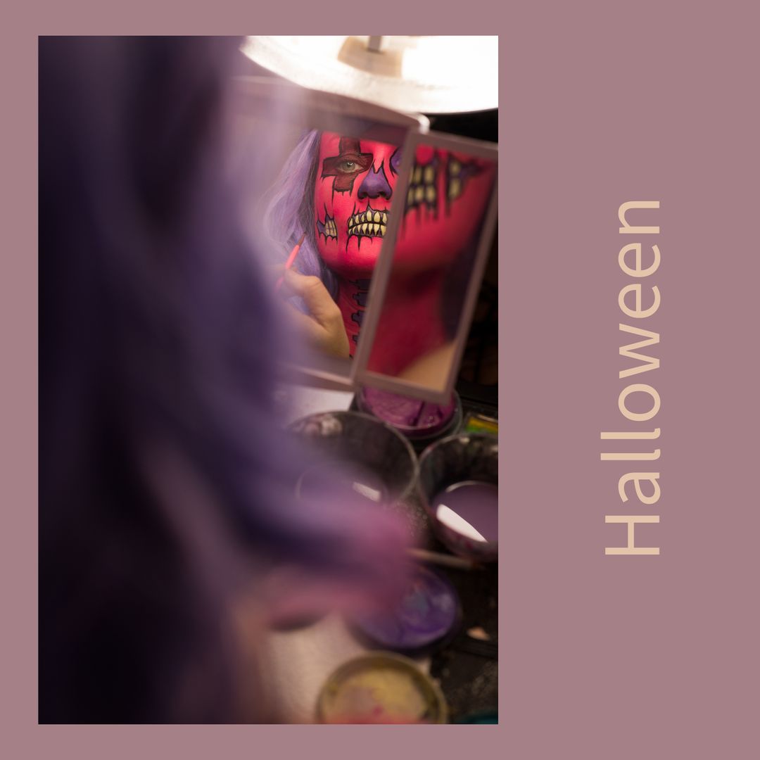 Woman Applying Vibrant Halloween Skull Makeup in Mirror Reflection