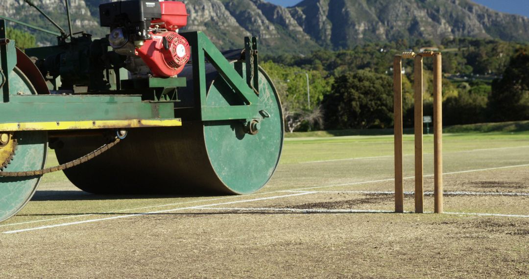 Cricket Ground Roller and Stumps on Sunny Day - Free Images, Stock Photos and Pictures on Pikwizard.com