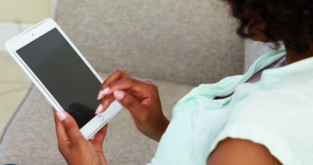 Woman Using Tablet at Home - Free Images, Stock Photos and Pictures on Pikwizard.com