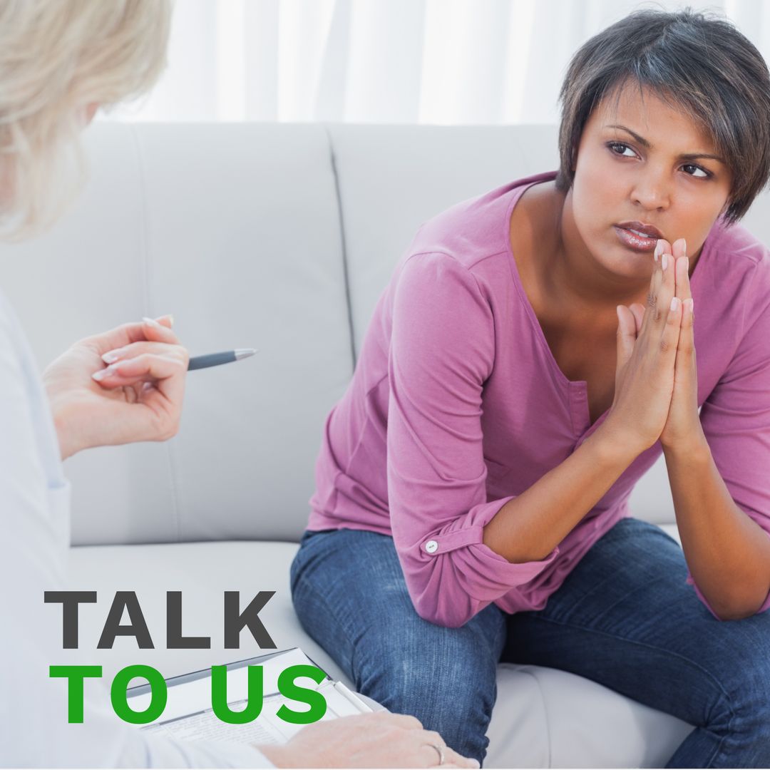 Woman Consulting with Therapist in Counseling Session