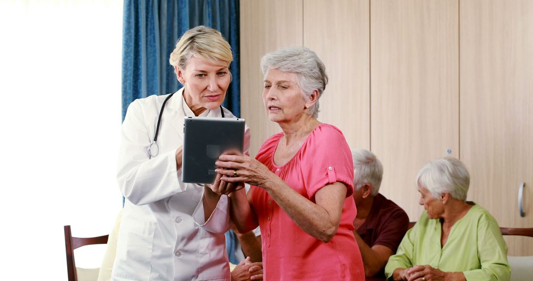 Doctor Explaining Test Results to Senior Woman with Tablet - Free Images, Stock Photos and Pictures on Pikwizard.com