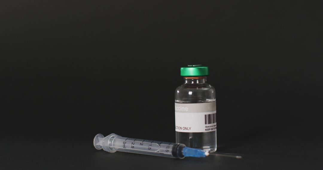 Image of close up of vaccine vial on black background - Free Images, Stock Photos and Pictures on Pikwizard.com