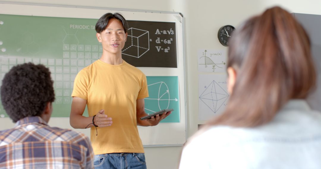 High School Student Presenting with Tablet in Classroom