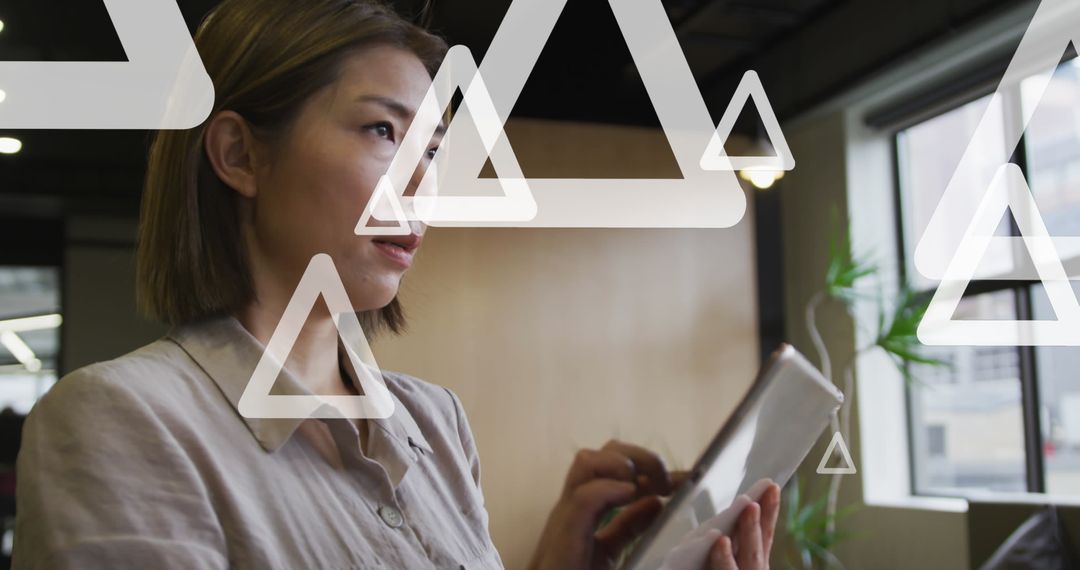 Professional Woman Using Tablet with Geometric Overlays