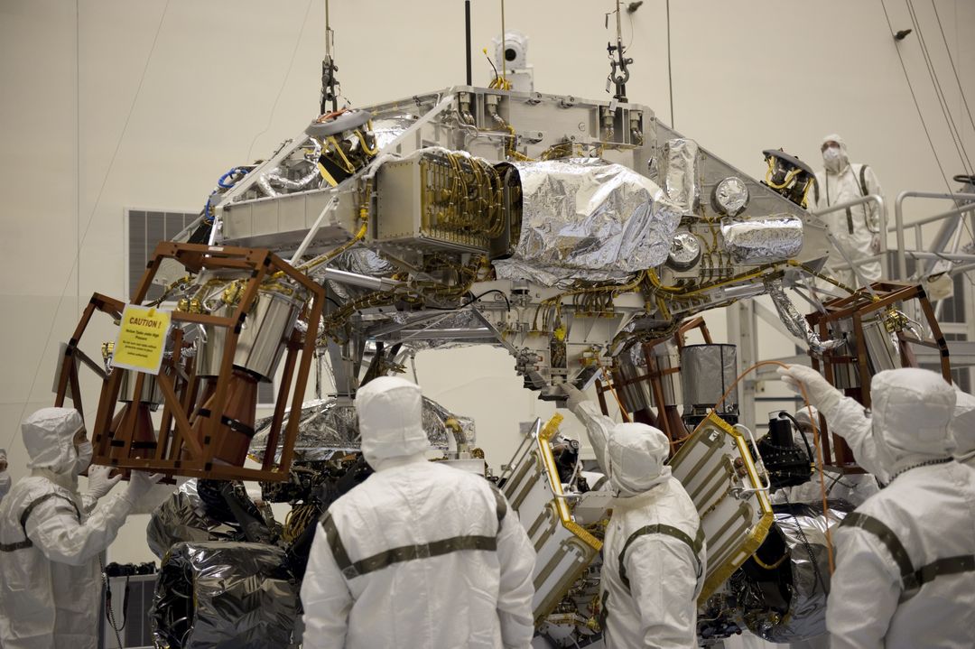 Technicians Lowering Descent Stage Over Mars Curiosity Rover for Integration