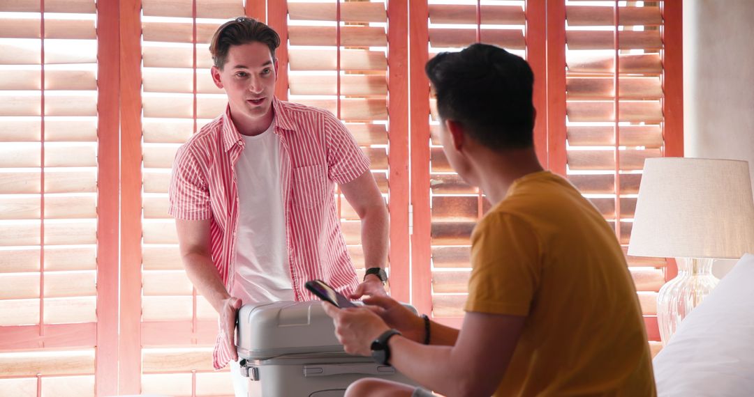 Friends Preparing for Travel with Suitcase and Smartphone