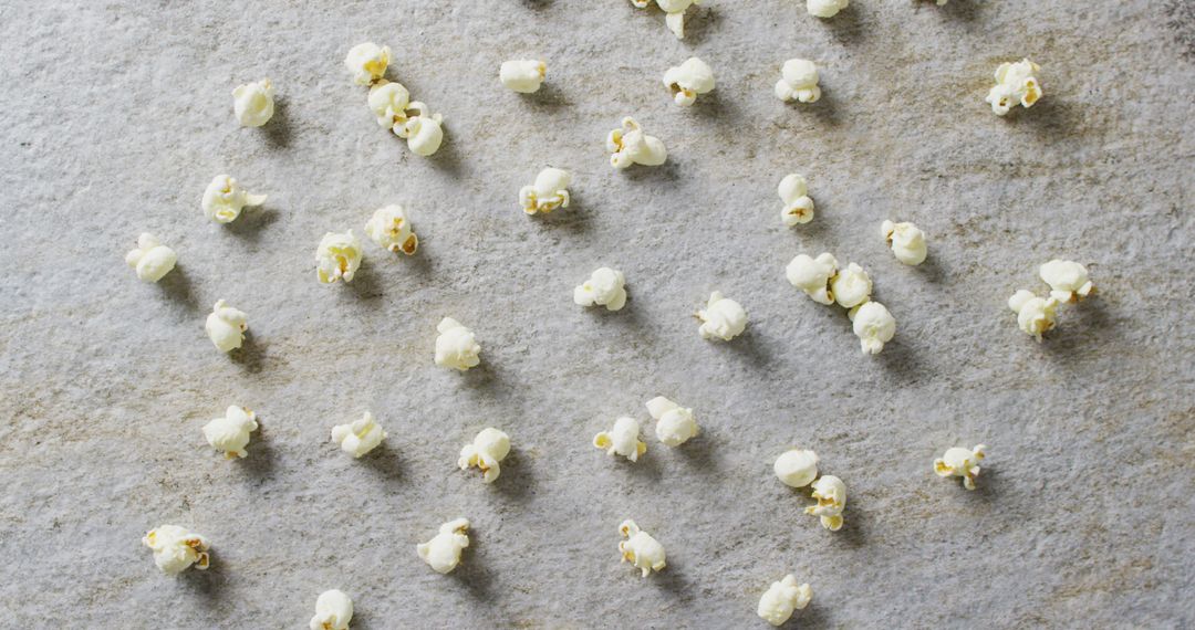 Scattered Popcorn on Gray Background with Top View