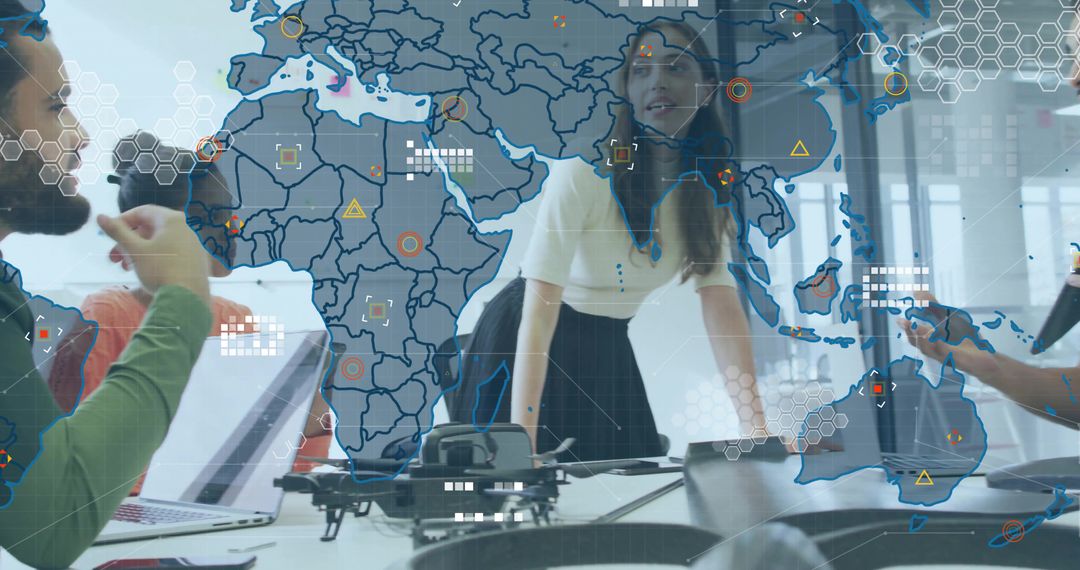 Innovative Team Analyzing Drone Data on Digital World Map