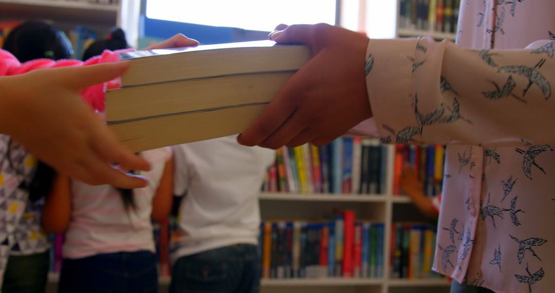 Teacher Receiving Books from Schoolgirl in a Library