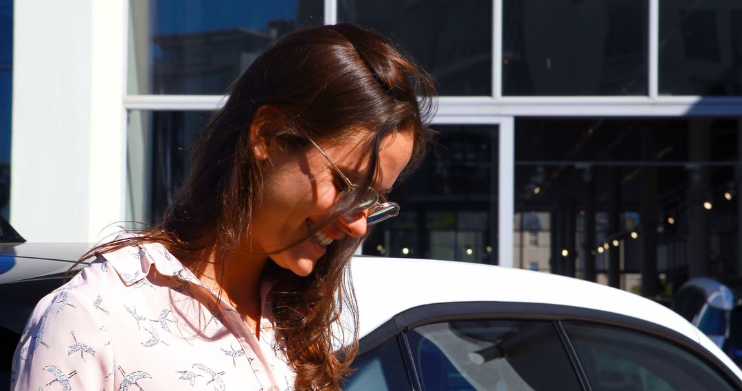 Smiling Woman in Sunglasses Standing by Car in Urban Setting - Free Images, Stock Photos and Pictures on Pikwizard.com