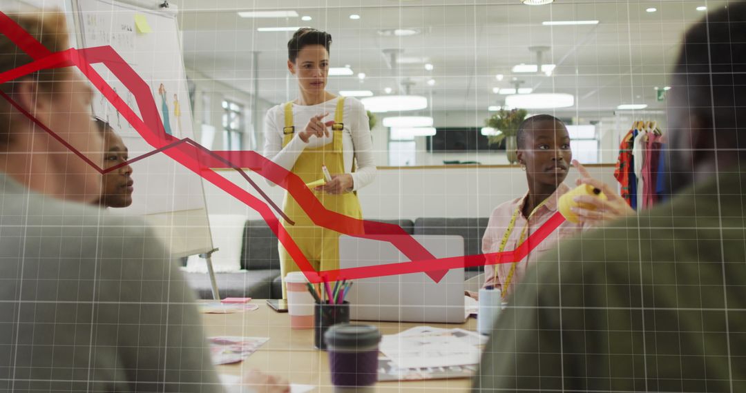 Diverse Fashion Design Team Analyzing Business Data with Graph Overlay