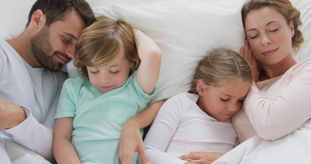 Peaceful Family Sleeping in Bed Together - Free Images, Stock Photos and Pictures on Pikwizard.com