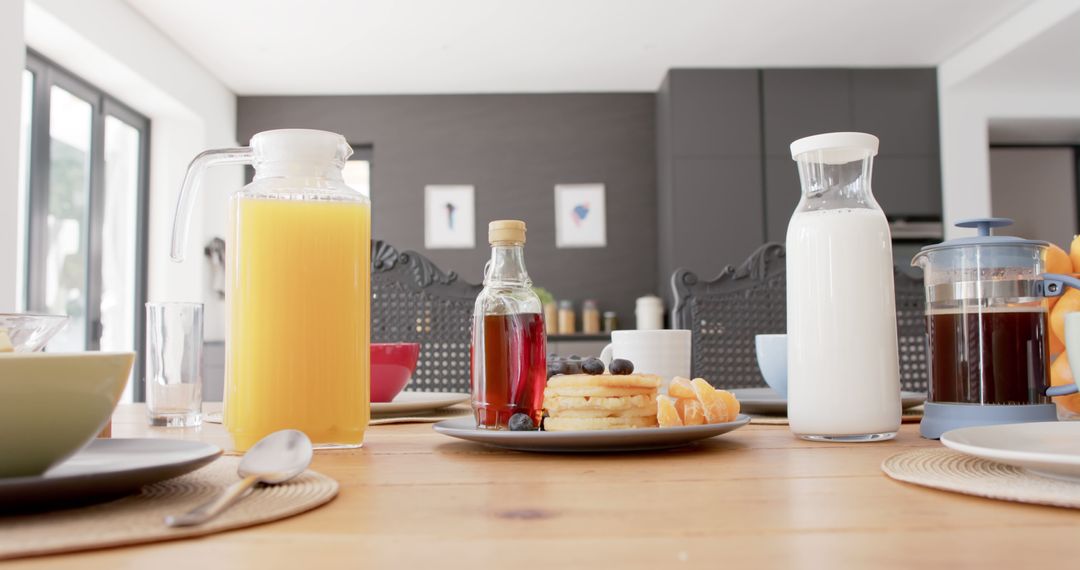 Modern Breakfast Table with Pancakes, Juice, and Milk - Free Images, Stock Photos and Pictures on Pikwizard.com