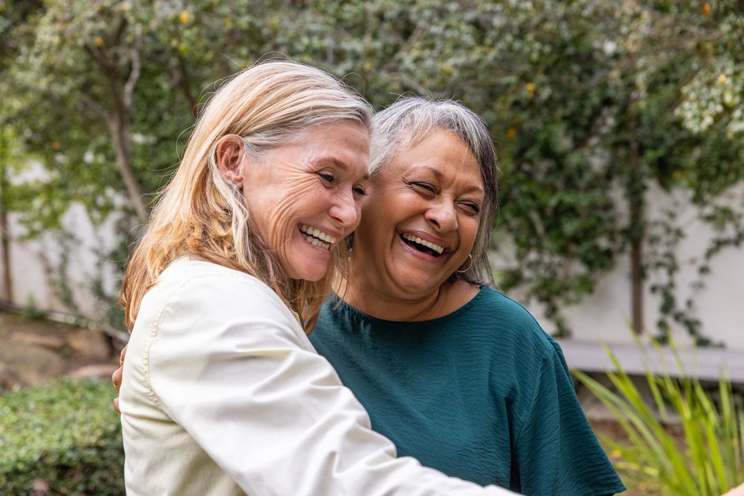 Senior Friends Embracing in Tranquil Garden
