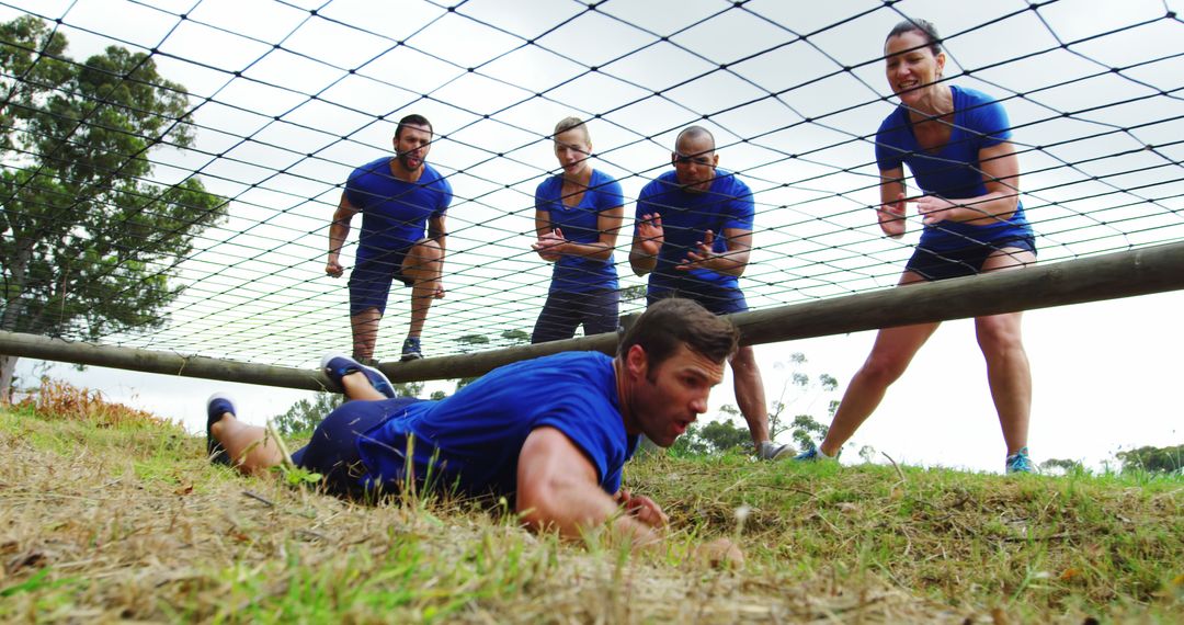 Diverse team conquering obstacle course with team spirit