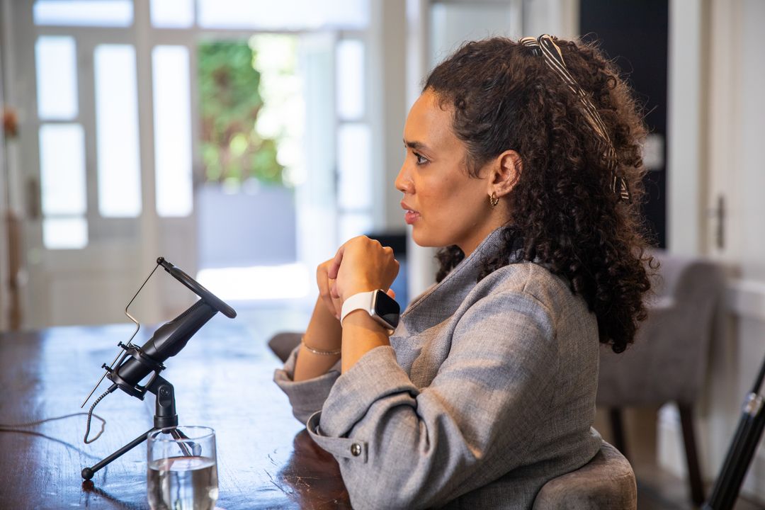 Professional Podcast Host Speaking in Modern Studio