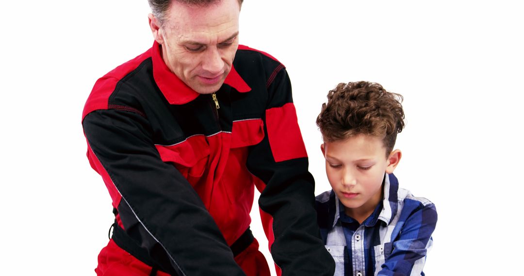 Mechanic Teaching Young Boy About Tools and Repairing - Free Images, Stock Photos and Pictures on Pikwizard.com