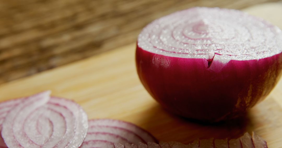 Freshly Sliced Red Onion on Wooden Cutting Board - Free Images, Stock Photos and Pictures on Pikwizard.com