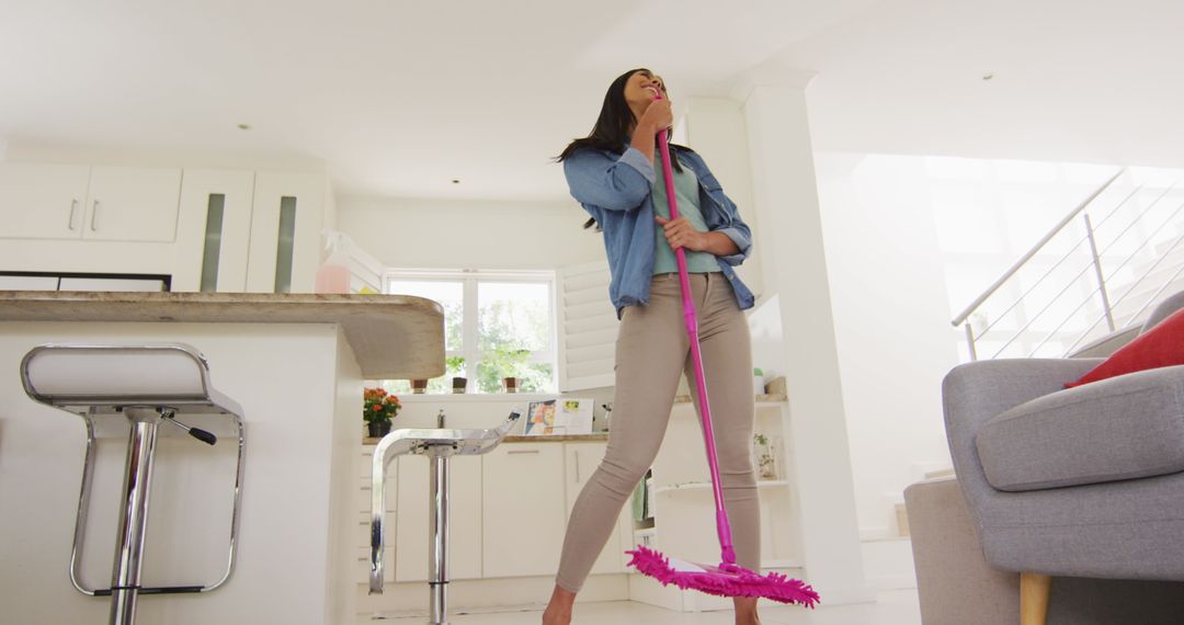  Woman Singing While Cleaning Modern Kitchen - Free Images, Stock Photos and Pictures on Pikwizard.com