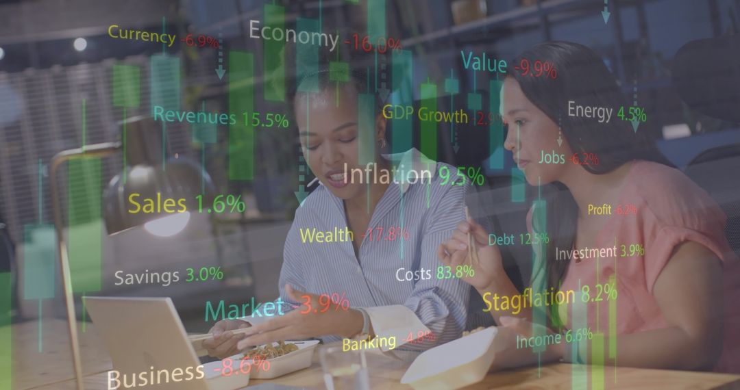 Diverse Colleagues Analyzing Financial Graphics in Casual Workspace