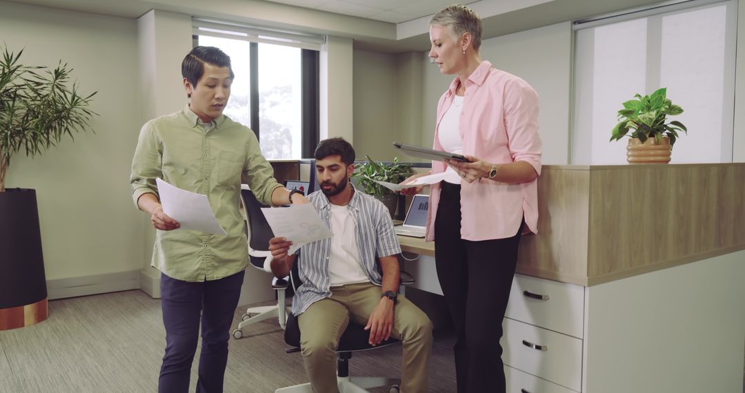 Diverse Team Collaborating in Modern Office Sharing Ideas