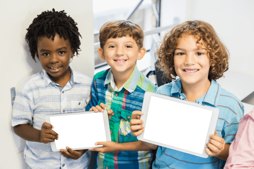 Joyful Children Holding Transparent Tablets in Classroom