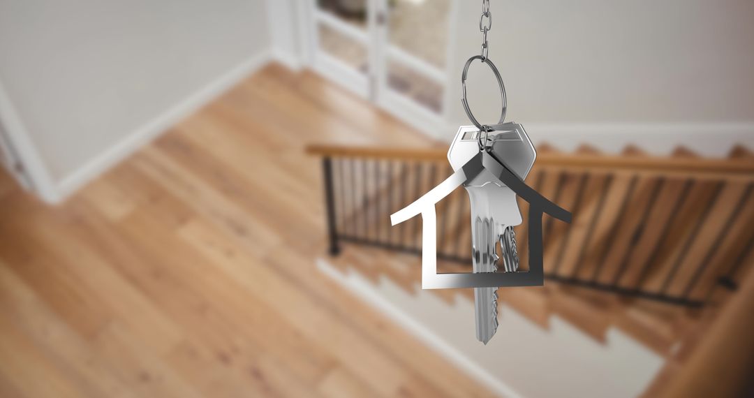 House Key on Keyring in Blurred Home Interior