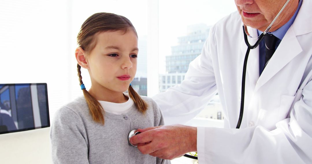 Pediatric Check-up with Experienced Doctor Using Stethoscope