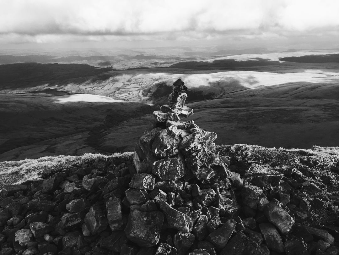 Rock Cairn on Mountain Overlooking Vast Landscape - Free Images, Stock Photos and Pictures on Pikwizard.com