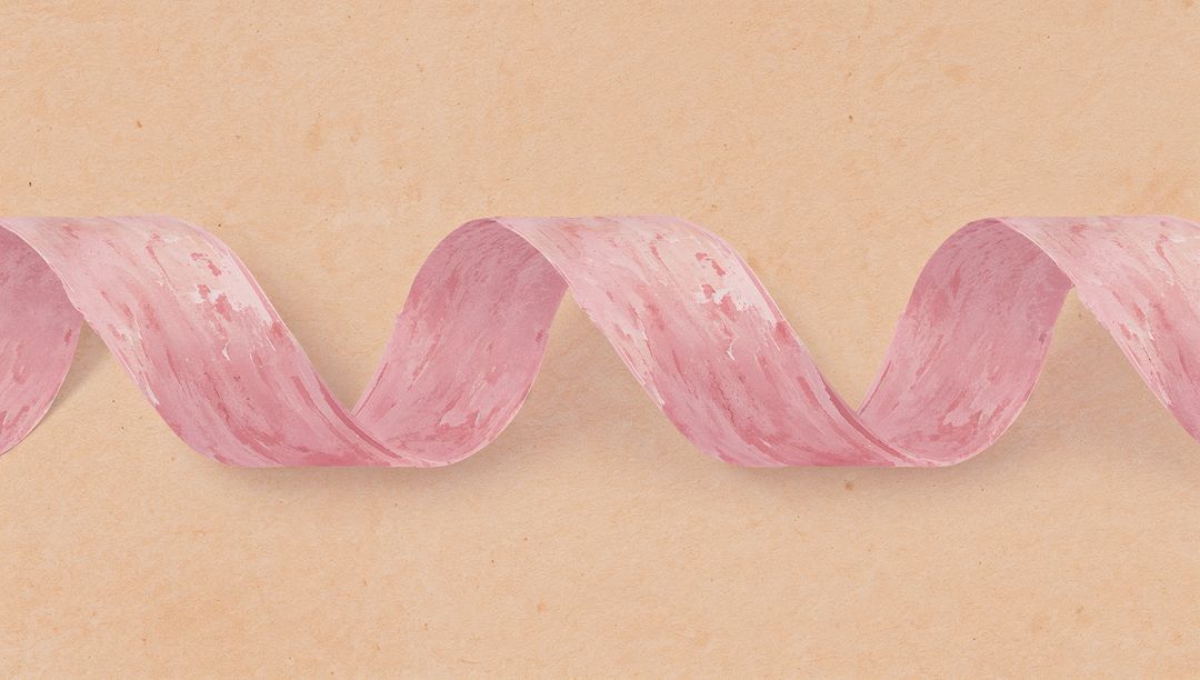 Elegant Pink Ribbon with Gentle Curve on Textured Surface