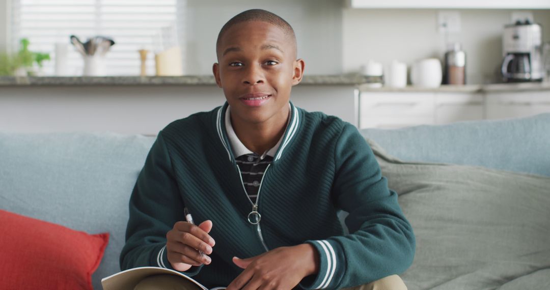 Image of happy african american boy having online lessons at home - Free Images, Stock Photos and Pictures on Pikwizard.com