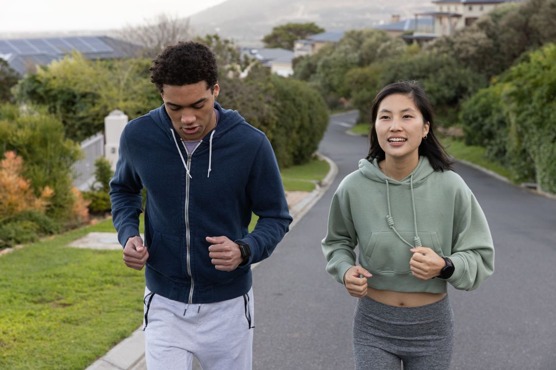 Diverse Runners Exercising Together in Suburban Neighborhood