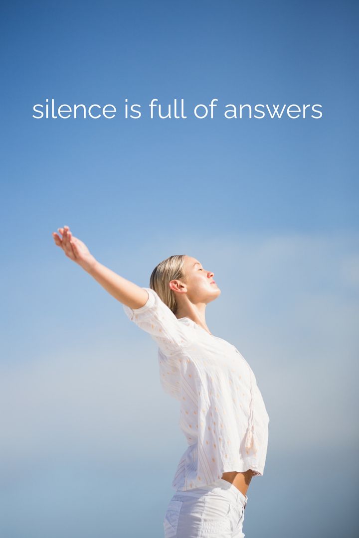 Woman Embracing Serenity Under Clear Blue Sky