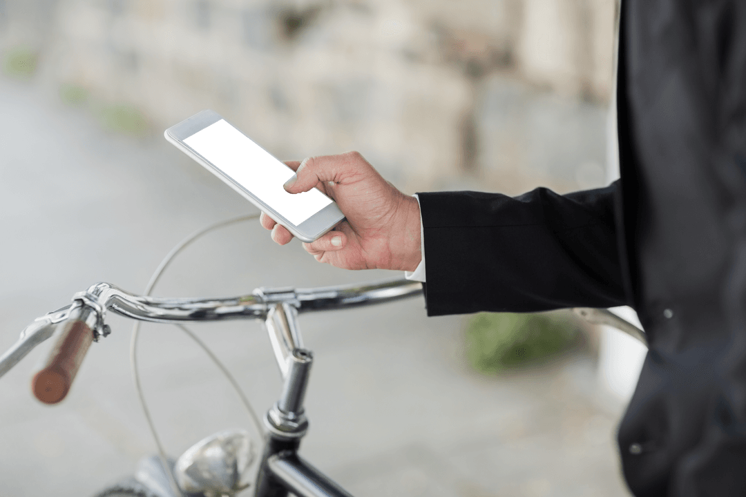 Businessman Holding Smartphone with Transparent Screen on City Street