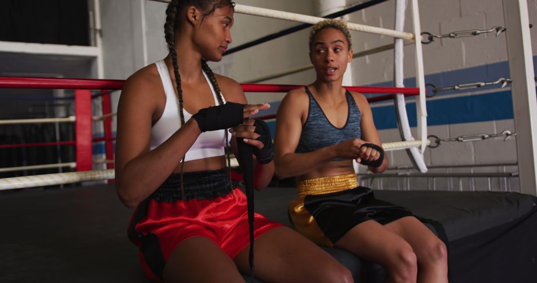 Two Female Boxers Wrapping Hands Before Training - Free Images, Stock Photos and Pictures on Pikwizard.com