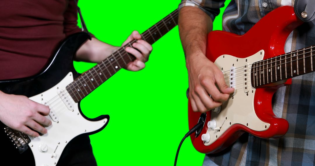 Close-Up of Musicians Playing Electric Guitars with Green Screen Background - Free Images, Stock Photos and Pictures on Pikwizard.com