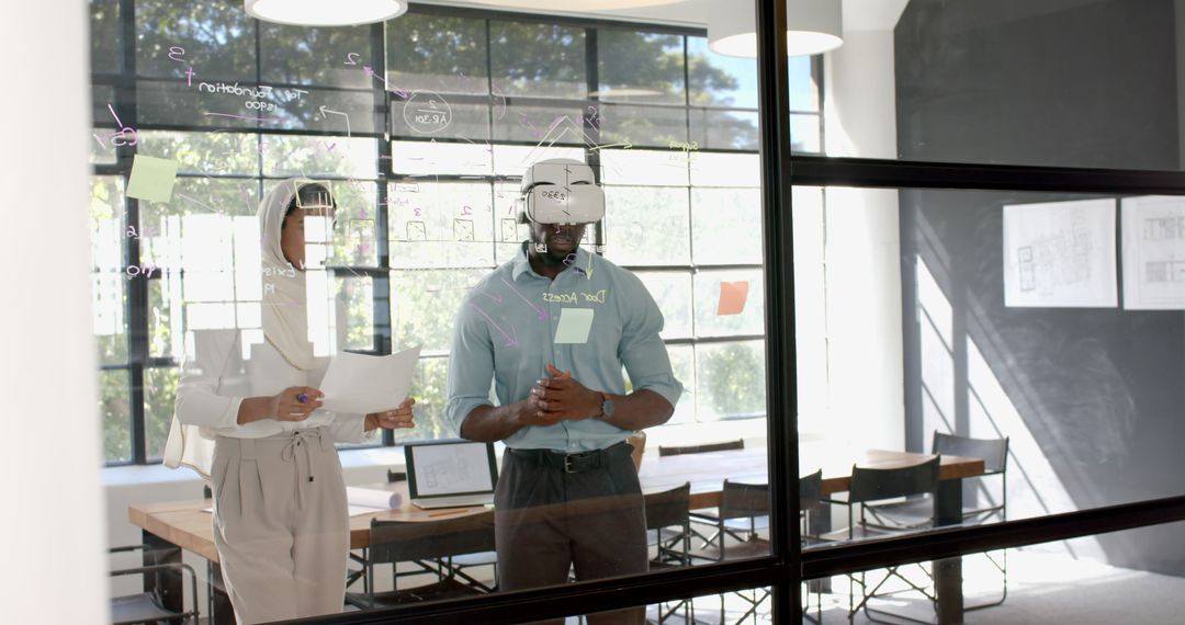 Colleagues Collaborating Brainstorming with Glass Board