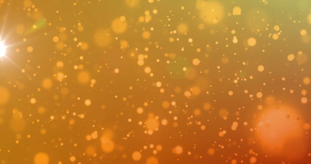 Golden Bokeh Sparkles on Warm Orange Background