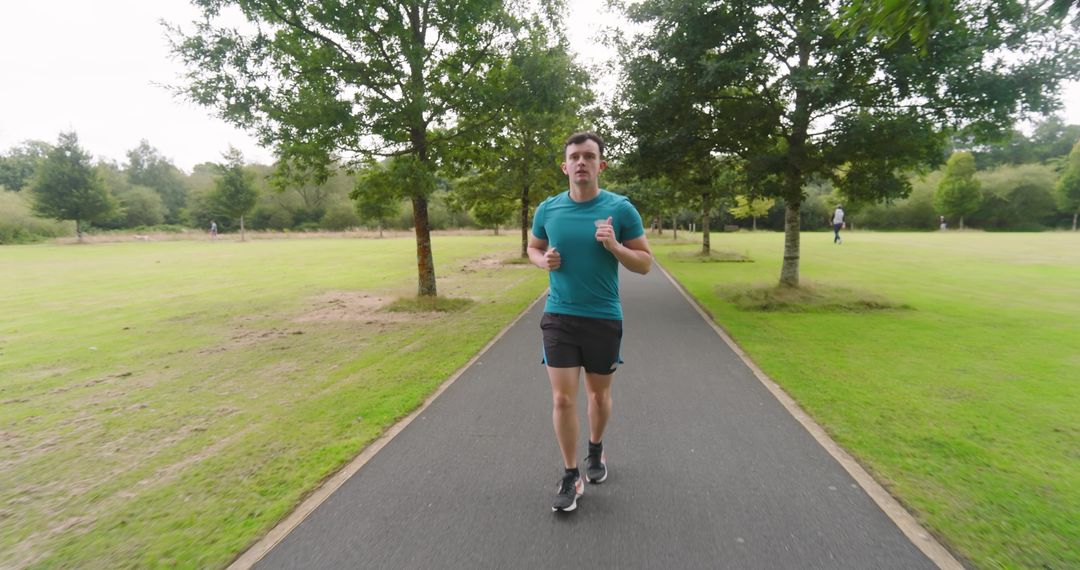 Man Jogging in Park for Health and Fitness