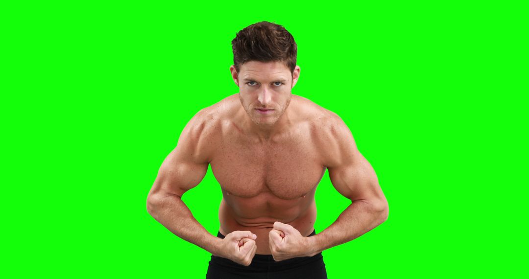 Fit Man Flexing Muscles with Green Screen Background - Free Images, Stock Photos and Pictures on Pikwizard.com